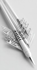 Close-up of three white, stylized, futuristic pens. 