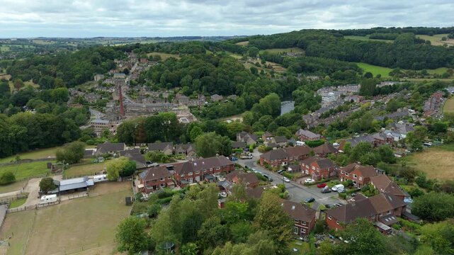 Aerial view cinematic drone scenic Millbrook village in Derbyshire Dales, green landscape tourist destination England UK