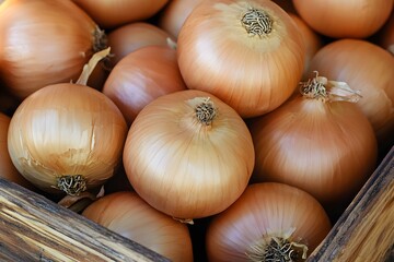 Close-up of fresh yellow onions in a wooden crate vegetables