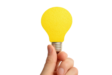 A hand holding a bright yellow lightbulb
