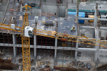 Tower Crane Working on Construction Building