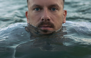 Portrait of a man in the sea water