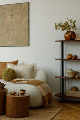 Modern living room with beige sofa, green cushion, wooden side table and decorative shelf with ceramics and books.