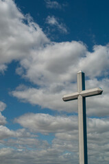 Buenos Aires, Argentina: white cross and blue sky with clouds in Puerto Madero, known as Puerto Madero Waterfront, famous barrio in the Central Business District on the Rio de la Plata riverbank
