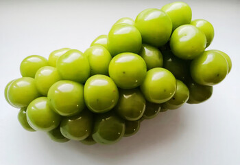 Enticing emerald grapes glisten like verdant jewels, ideal for Wine Harvest Festival celebrations...