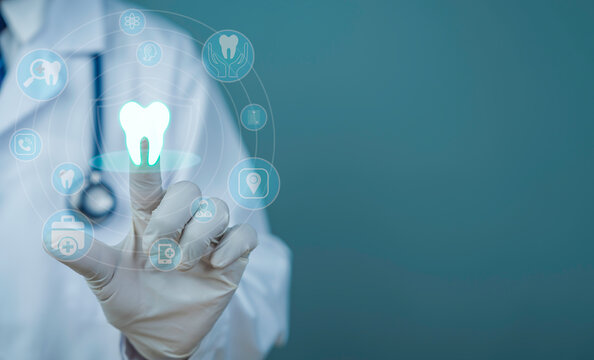 Dentist using digital dental interface with tooth icon medical technology innovation virtual healthcare system