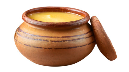 Rich golden ghee in rustic clay pot with traditional mortar for authentic culinary preparation isolated on white background