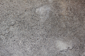 black cement wall background with spotted texture