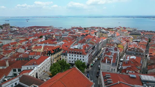 Aerial view from Lisbon with the tejo rivar at background. Portugal - Backwards drone shot