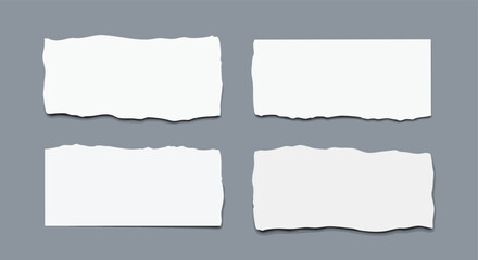 Four blank torn paper pieces arranged on a clean grey background for creative projects