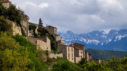 Charming village on a mountainside with a stunning natural backdrop