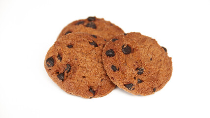 Isolated clipping path of die cut dark chocolate chip cookies on white background. Closeup tasty bakery organic homemade American biscuit sweet dessert