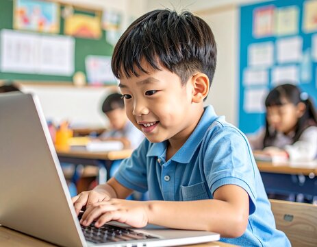 Asian boy typing on a laptop in a modest classroom - Powered by Adobe