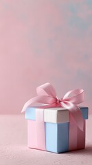 Obraz premium Elegant Gift Box with Pink Ribbon on Pastel Background