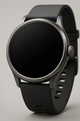 A sleek, modern smartwatch with a round blank screen, dark grey case, and a black silicone strap on a plain background.