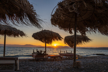 Beach umbrellas at sunset