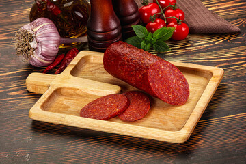 Spicy pepperoni sausages with sliced piece