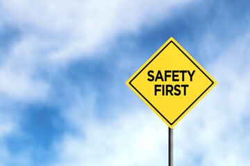 Yellow Road Sign Promoting Safety First Against Cloudy Sky