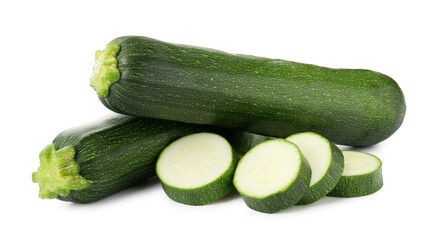 Whole and cut fresh zucchinis isolated on white