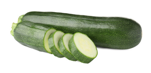 Whole and cut fresh zucchinis isolated on white