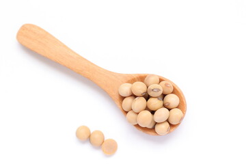 wooden spoon with yellow soy bean 