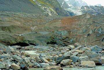Mountain landscape with a view of a glacier. Tana Glacier in North Ossetia. Melting glaciers in the highlands.
