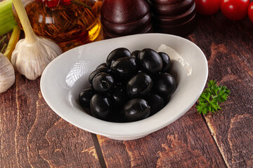 Mediterranean marinated Black olives in the bowl