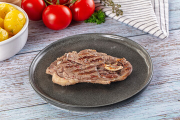 Grilled lamb steak with bone
