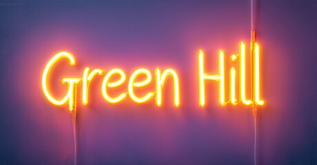 Bright neon sign displays Green Hill. Warm orange glow contrasts purple backdrop. Simple typography, modern aesthetic.