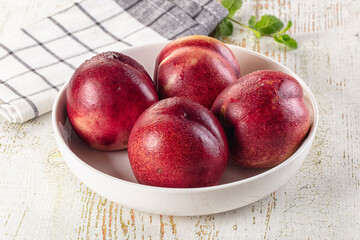 Ripe sweet juicy nectarines heap