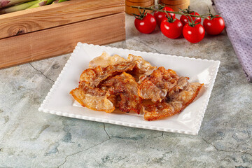 Fried crispy pork bacon snack