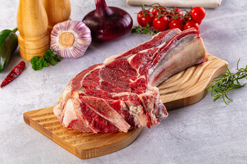 Raw prime beef steak with bone