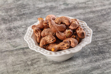 Unpeeled cashew nuts in the bowl