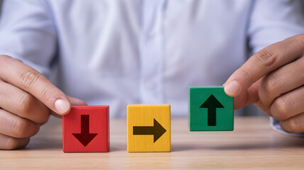Businessman Holding Blocks With Up Down And Side Arrows Representing Decision Choice Direction Growth Risk Strategy