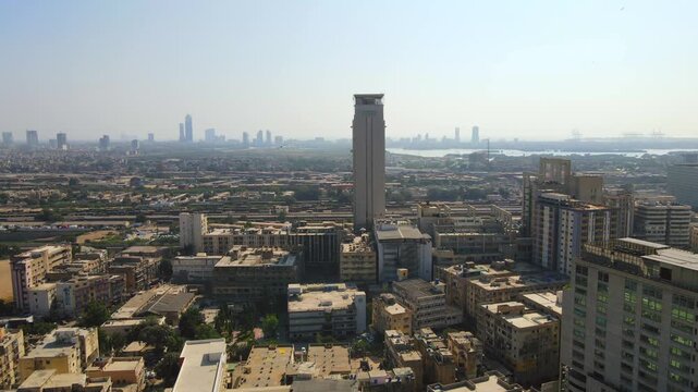 Aerial view of the Habib Bank Plaza tower rising above the cityscape, showcasing a dense urban environment with buildings, Karachi, Sindh, Pakistan.