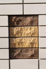 Brick wall with decorative stone insert