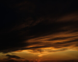 Sunset sky with orange clouds. Nature background.