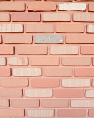Close up of a pink brick wall with a unique pattern, showcasing texture, construction, and architectural detail for a vintage and decorative background