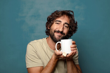 young adult bearded man with a tea mug