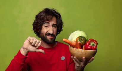 young adult bearded man with vegetables
