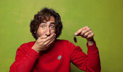 young adult bearded man. cockroach concept