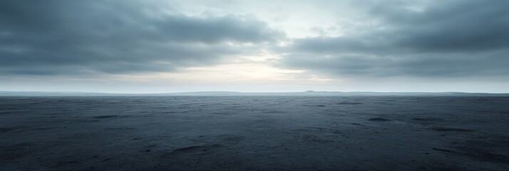 Serene ocean horizon under dramatic cloudy sky at dusk