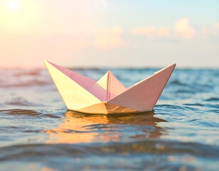 Pink paper boat on water at sunset