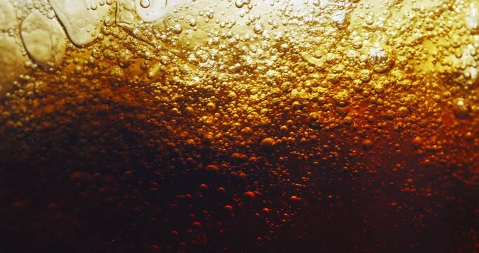 Slow Motion Close Up Of Dark Cola Soda Bubbles Rising, Carbonated Drink Effervescent Texture In Macro, Fizzy Refreshing Cold Beverage Background For Abstract Concept And Refreshment At 1000 Fps
