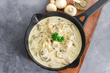 Creamy Chicken Stroganoff served in Iron Skillet, traditional Russian-inspired cuisine, top view