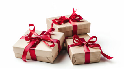 Obraz premium Stack of beige and light wood eco color gift boxes tied with red ribbons and bows, arranged on a white background for a festive, elegant presentation.