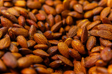 Almond background. Almonds top view background. Whole almond nuts flat lay. Full depth of field. Perfect not AI almond, true photo