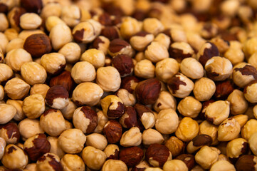 Nut background. Heap of peeled hazelnuts. Top view of roasted beautiful peeled hazelnuts