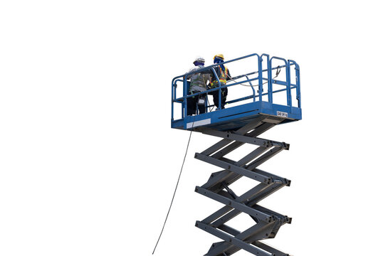 Construction worker wearing safety harnesses in mobile crane bucket at construction site. working at heights above ground ,safety for working at heights concept