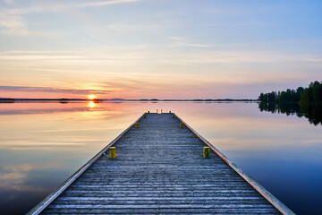 wooden pier at sunset